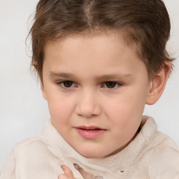 Joyful white child female with short  brown hair and brown eyes