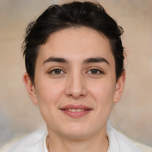 Joyful white young-adult female with short  brown hair and brown eyes