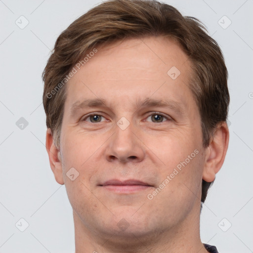 Joyful white adult male with short  brown hair and grey eyes