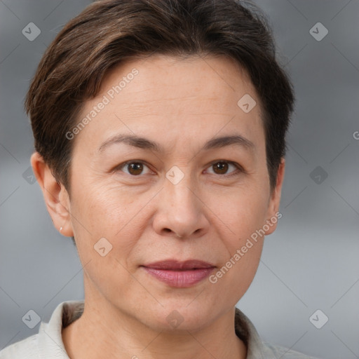 Joyful white adult female with short  brown hair and brown eyes