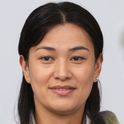 Joyful white adult female with medium  brown hair and brown eyes