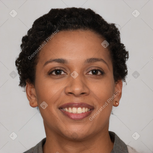 Joyful black young-adult female with short  brown hair and brown eyes