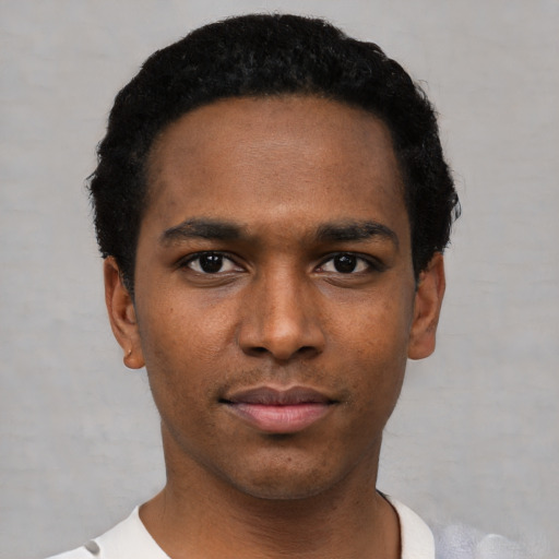 Neutral black young-adult male with short  black hair and brown eyes