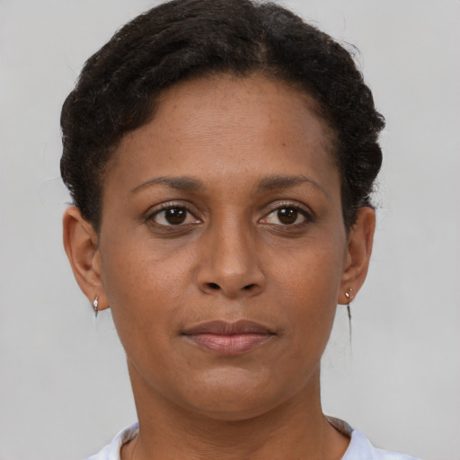 Neutral black young-adult female with short  brown hair and brown eyes