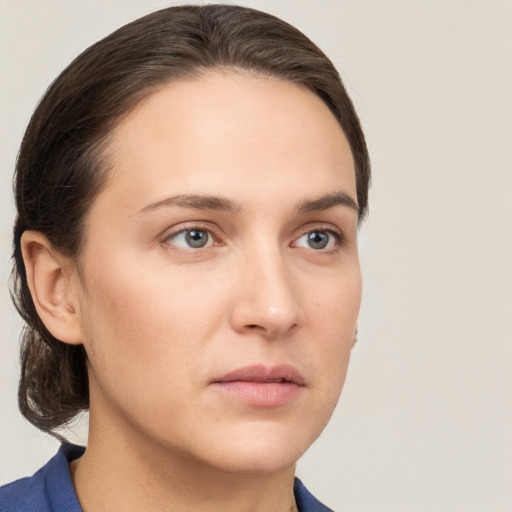 Neutral white young-adult female with medium  brown hair and grey eyes