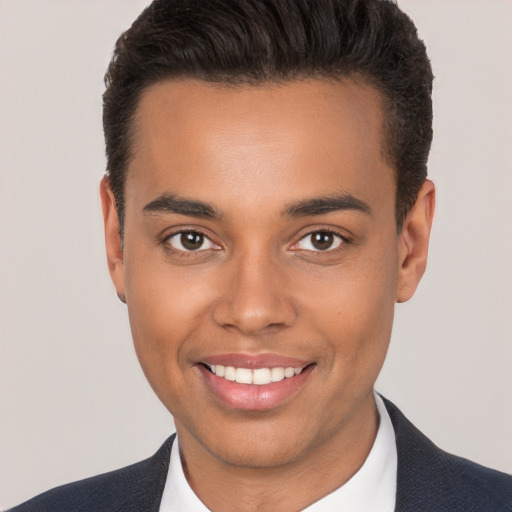 Joyful white young-adult male with short  brown hair and brown eyes