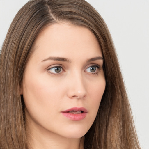 Neutral white young-adult female with long  brown hair and brown eyes