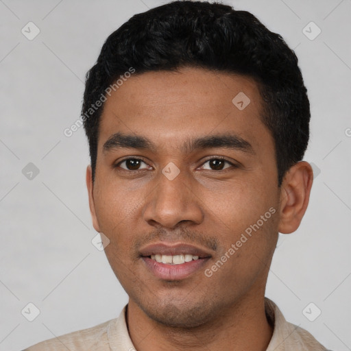 Joyful latino young-adult male with short  black hair and brown eyes