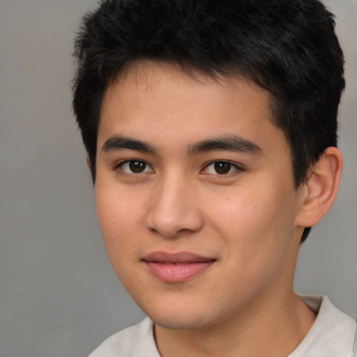 Joyful white young-adult male with short  black hair and brown eyes