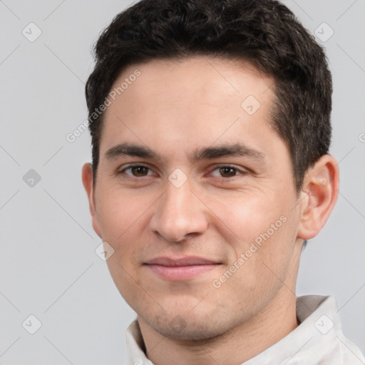 Joyful white young-adult male with short  black hair and brown eyes