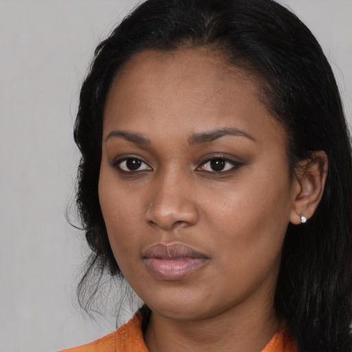 Neutral black young-adult female with long  black hair and brown eyes
