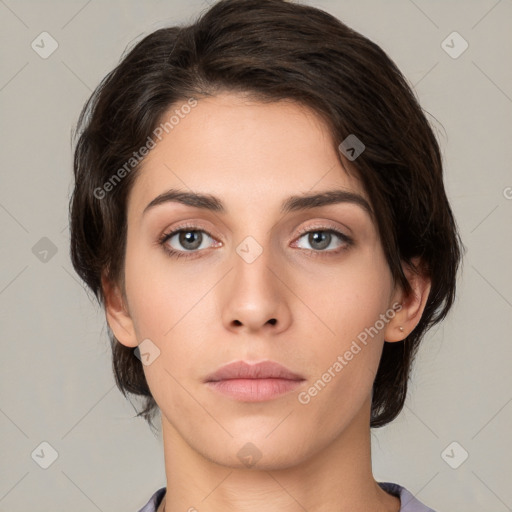 Neutral white young-adult female with medium  brown hair and brown eyes