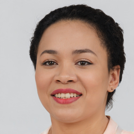 Joyful asian young-adult female with short  black hair and brown eyes