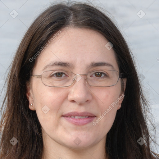 Joyful white adult female with long  brown hair and grey eyes