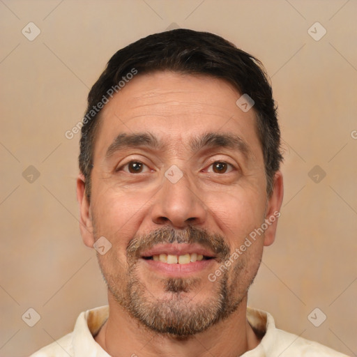 Joyful white adult male with short  black hair and brown eyes