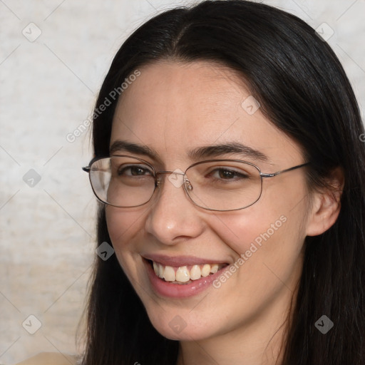 Joyful white adult female with long  brown hair and brown eyes