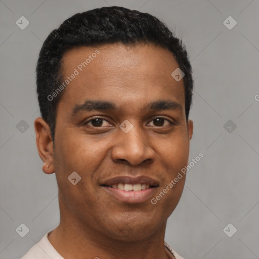 Joyful black young-adult male with short  black hair and brown eyes