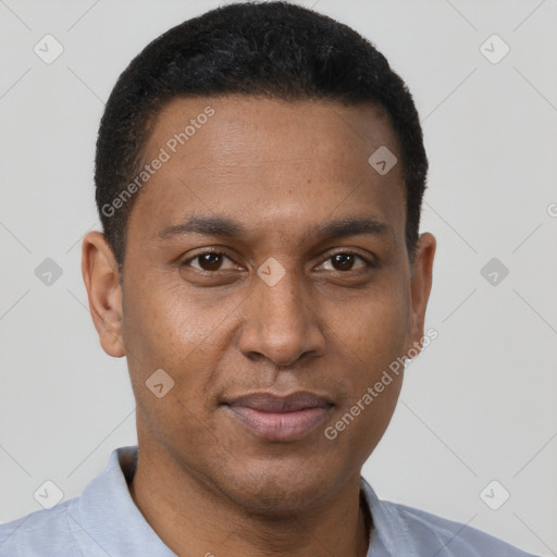 Joyful black young-adult male with short  brown hair and brown eyes