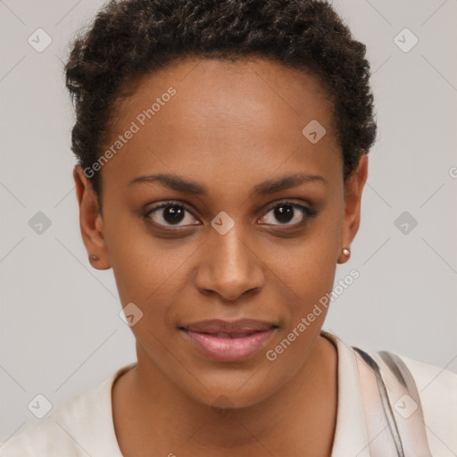 Joyful black young-adult female with short  brown hair and brown eyes