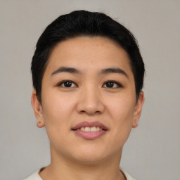 Joyful asian young-adult female with short  black hair and brown eyes