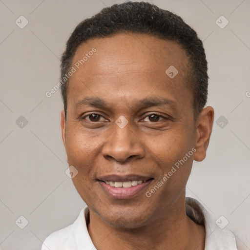 Joyful latino adult male with short  brown hair and brown eyes