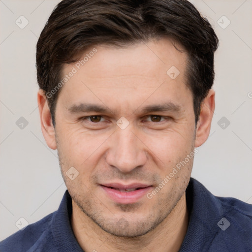 Joyful white adult male with short  brown hair and brown eyes