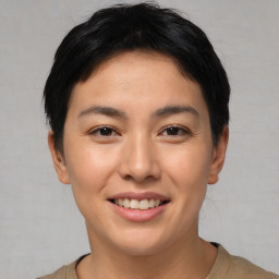 Joyful asian young-adult female with short  brown hair and brown eyes