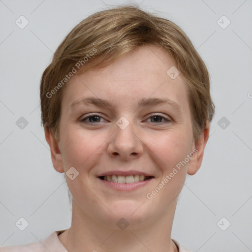 Joyful white young-adult female with short  brown hair and grey eyes