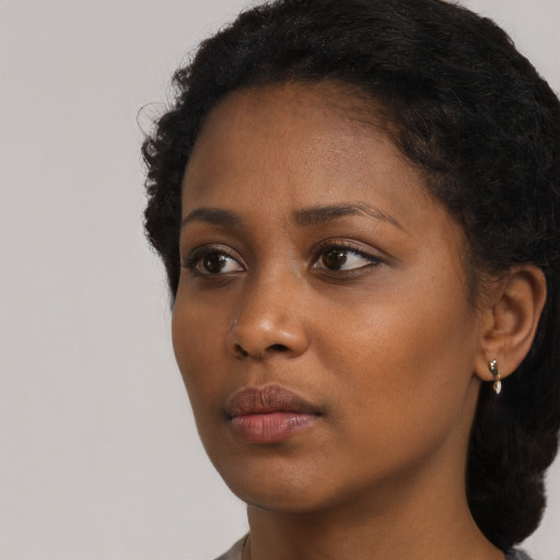 Neutral black young-adult female with long  black hair and brown eyes