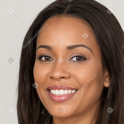 Joyful latino young-adult female with long  brown hair and brown eyes