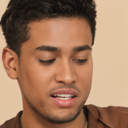 Joyful latino young-adult male with short  brown hair and brown eyes