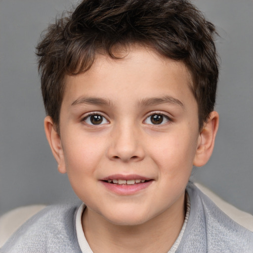 Joyful white child male with short  brown hair and brown eyes