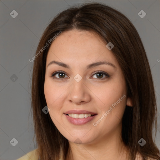 Joyful white young-adult female with long  brown hair and brown eyes