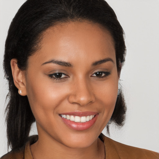 Joyful latino young-adult female with long  brown hair and brown eyes