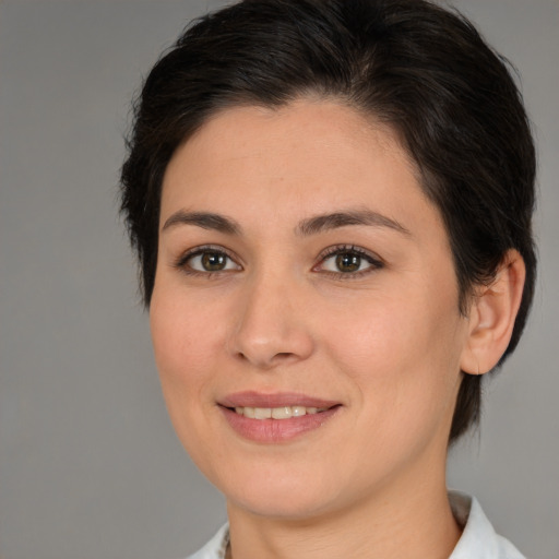 Joyful white young-adult female with medium  brown hair and brown eyes