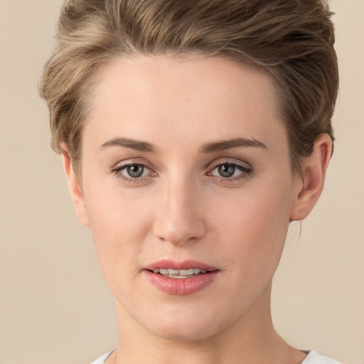 Joyful white young-adult female with short  brown hair and brown eyes