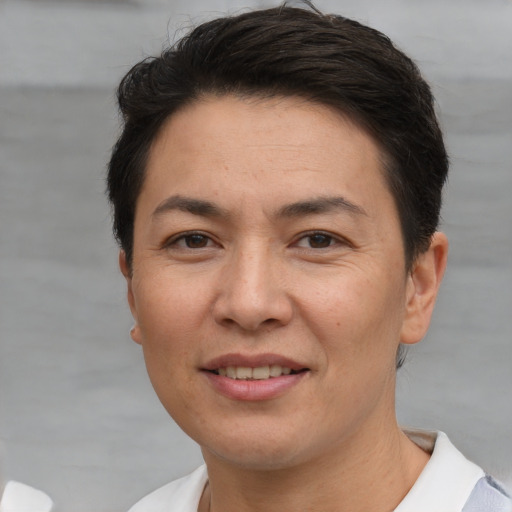 Joyful white adult female with short  brown hair and brown eyes