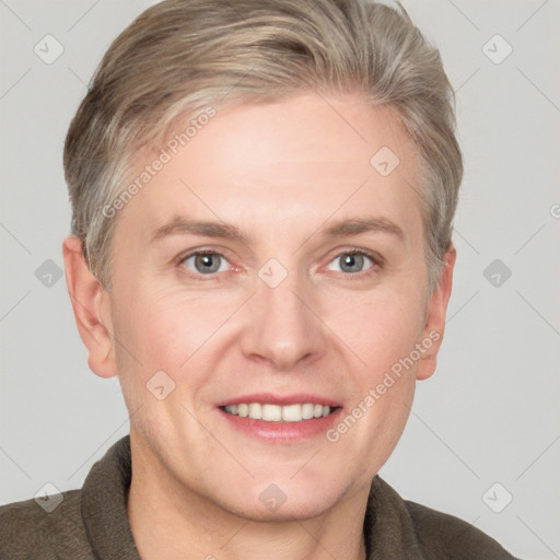 Joyful white adult female with short  brown hair and grey eyes