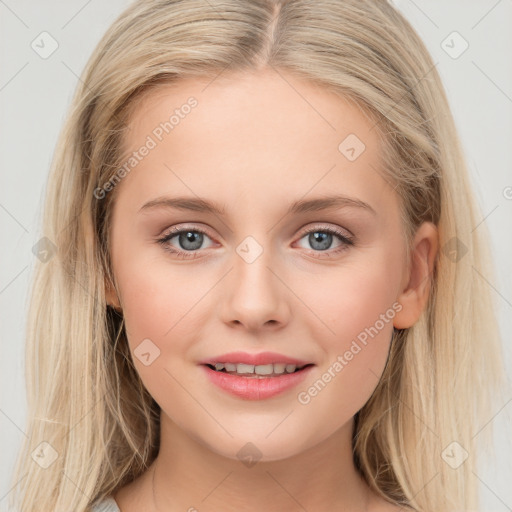 Joyful white young-adult female with long  brown hair and blue eyes