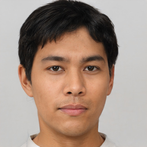 Neutral asian young-adult male with short  brown hair and brown eyes