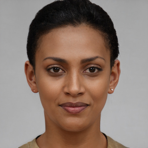 Joyful latino young-adult female with short  black hair and brown eyes