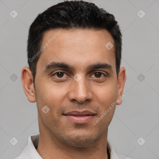 Joyful white young-adult male with short  black hair and brown eyes