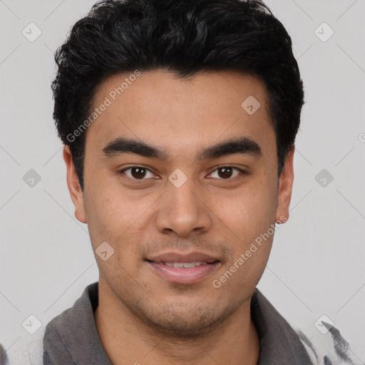 Joyful asian young-adult male with short  black hair and brown eyes