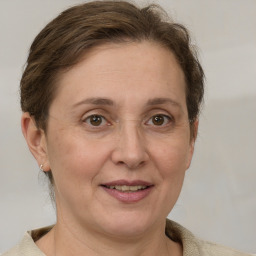 Joyful white adult female with short  brown hair and grey eyes