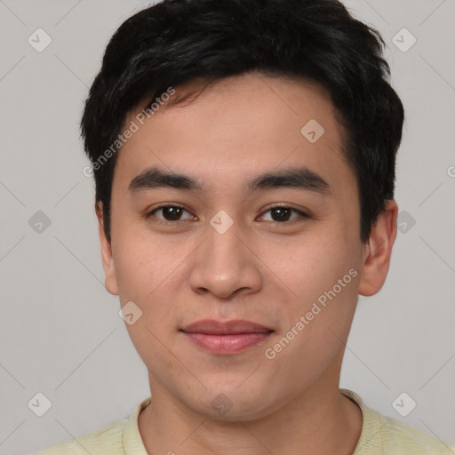 Joyful asian young-adult male with short  black hair and brown eyes