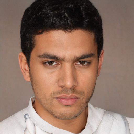 Neutral latino young-adult male with short  brown hair and brown eyes