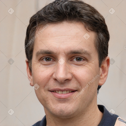 Joyful white adult male with short  brown hair and brown eyes