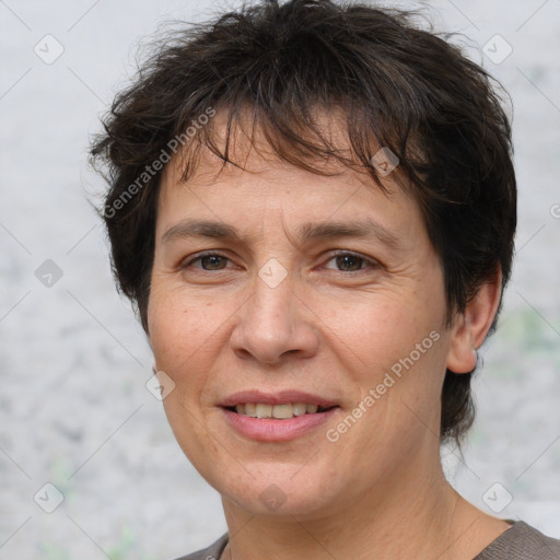 Joyful white adult female with short  brown hair and brown eyes