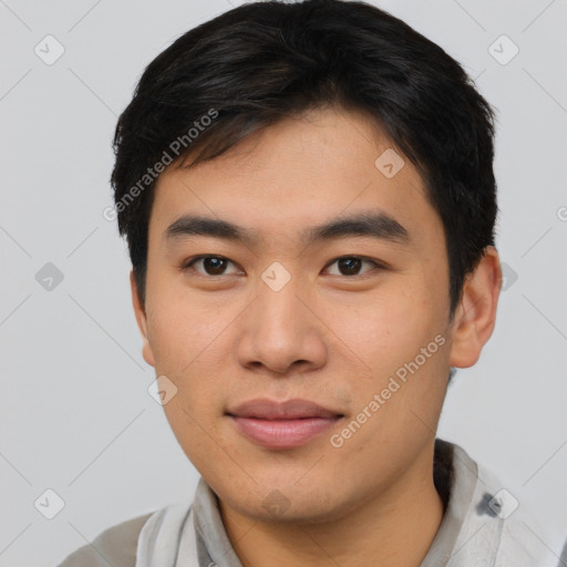 Joyful asian young-adult male with short  black hair and brown eyes