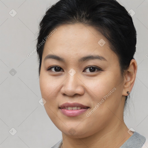 Joyful asian young-adult female with medium  brown hair and brown eyes